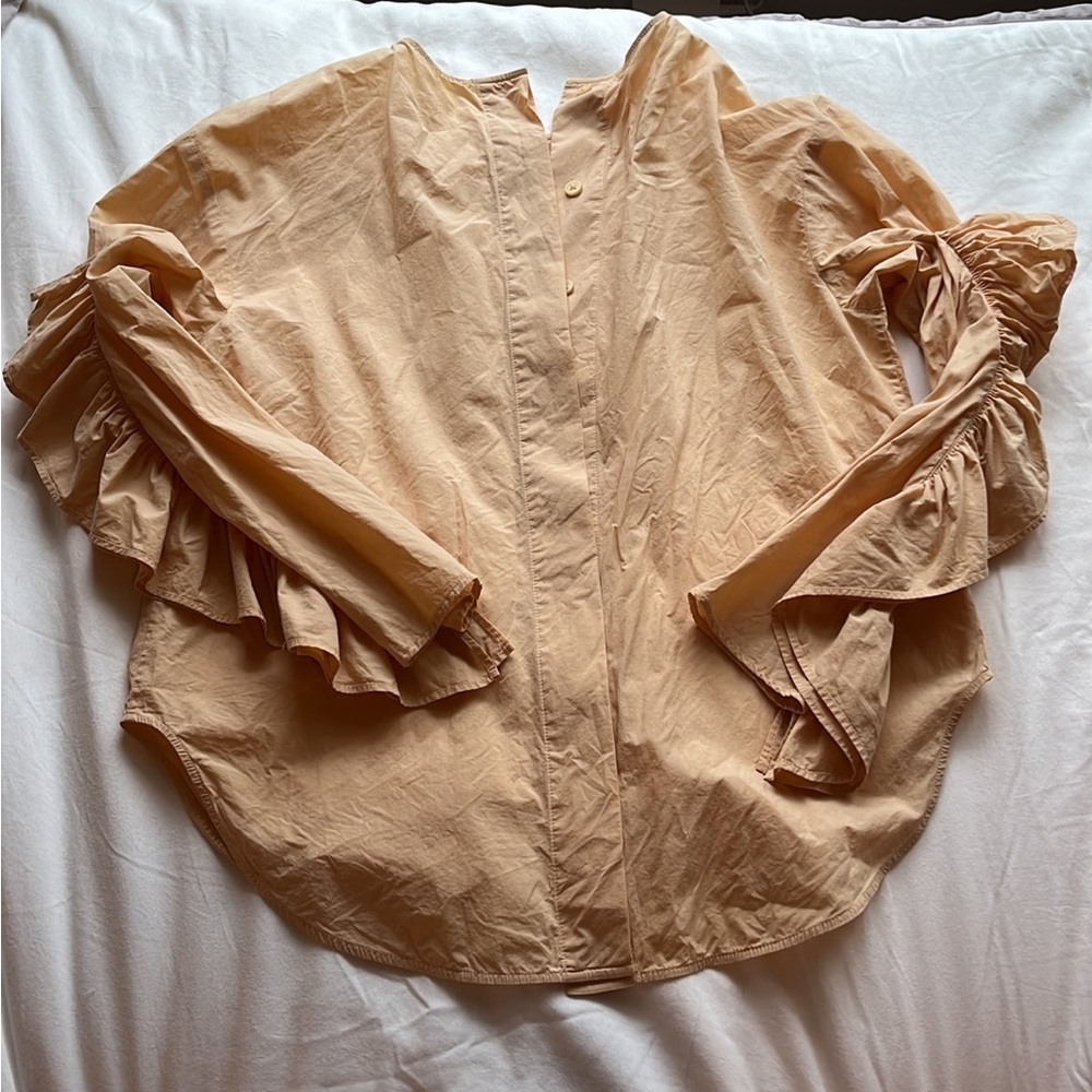 Orange shirt from Cos. The sleeves are so cute.